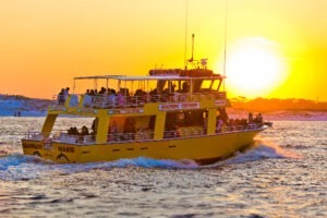 dolphin cruise boat at sunset